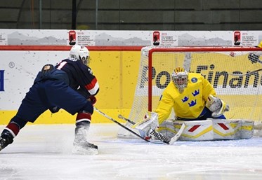 LUCERNE, SWITZERLAND - APRIL 19: USA's Christian Fischer #21 with a scoring chance against Sweden's Felix Sandstrom #29 during preliminary round action at the 2015 IIHF Ice Hockey U18 World Championship. (Photo by Matt Zambonin/HHOF-IIHF Images)

